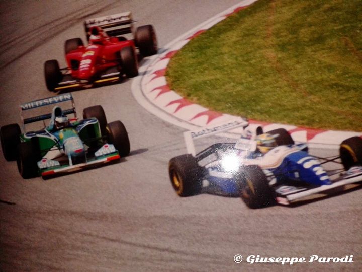 01 May 1994, Tosa curve. Ayrton Senna, Williams, followed by Michael Schumacher, Benetton and Gérard Berger, Ferrari, at the San Marino Grand Prix in Imola. 