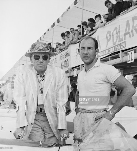 Britain's Ace Driver Stirling Moss is shown here February 23rd after he completed his practice laps