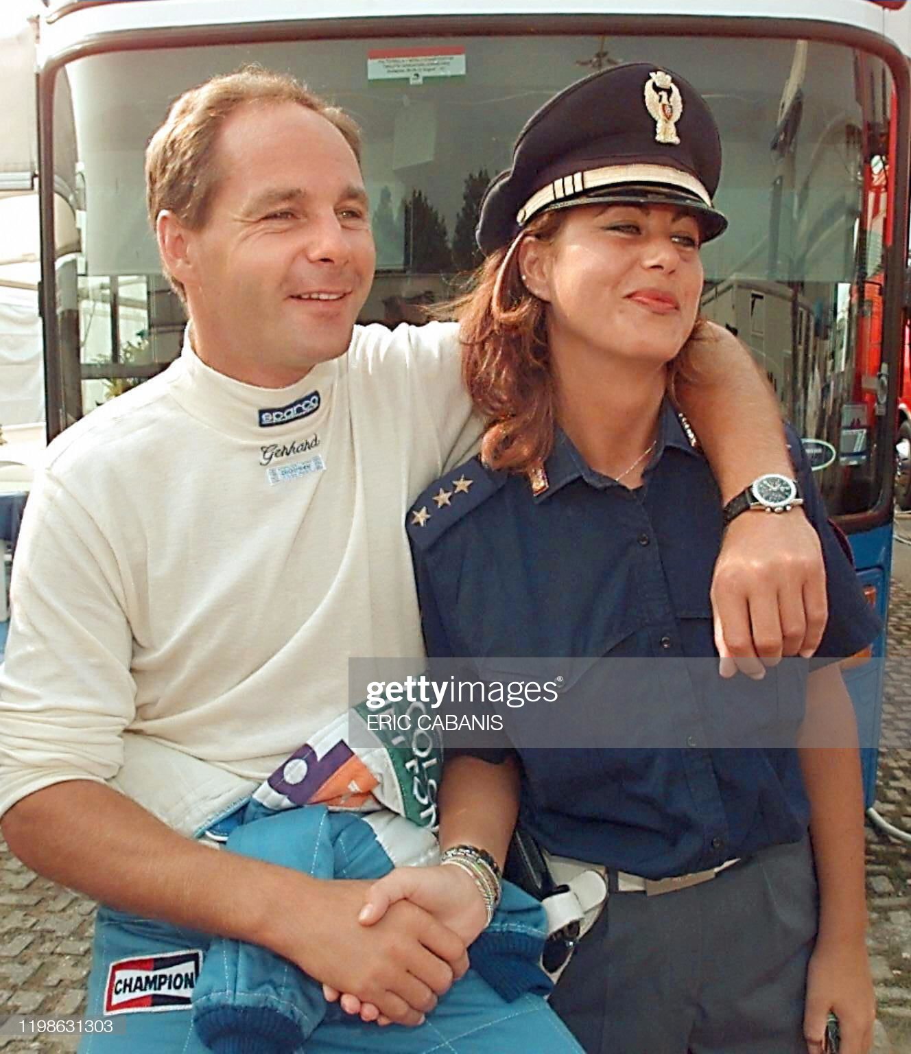 05 September 1997, Gerhard Berger jokes with an Italian policewoman. Photo by Getty Images.