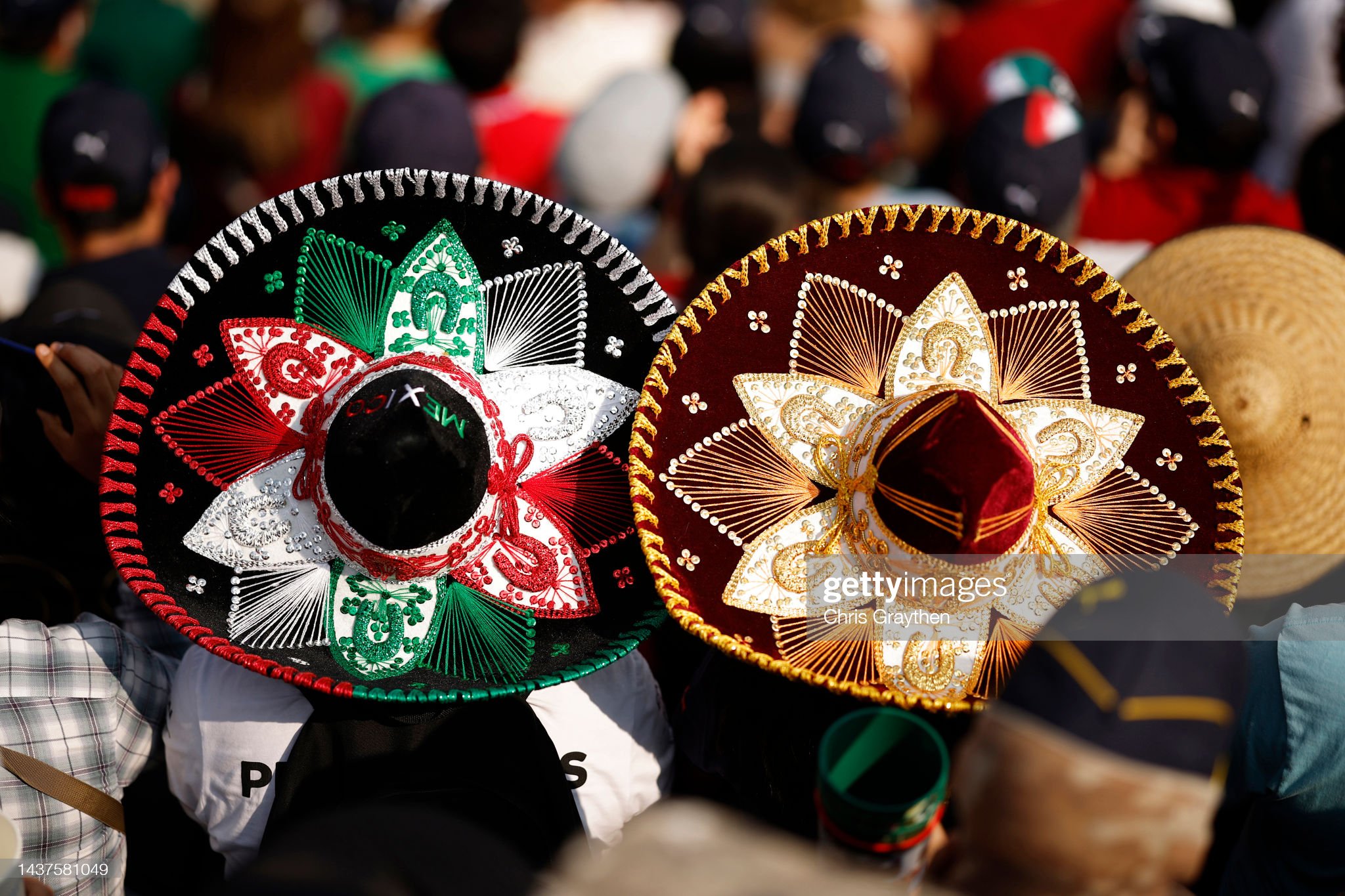 Fans with sombreros watch the action during qualifying.