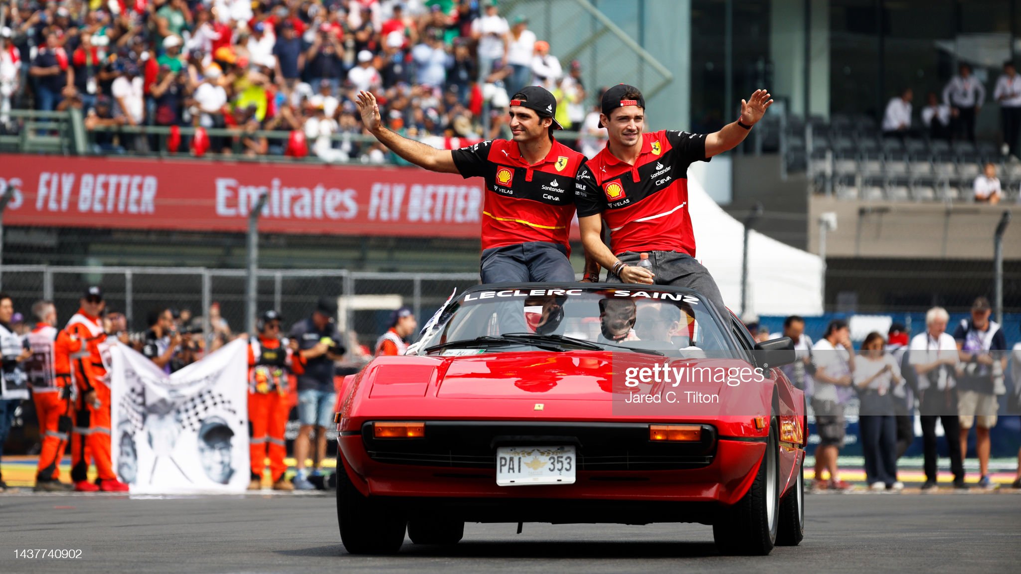 Charles Leclerc and Carlos Sainz wave to the crowd on the drivers’ parade.