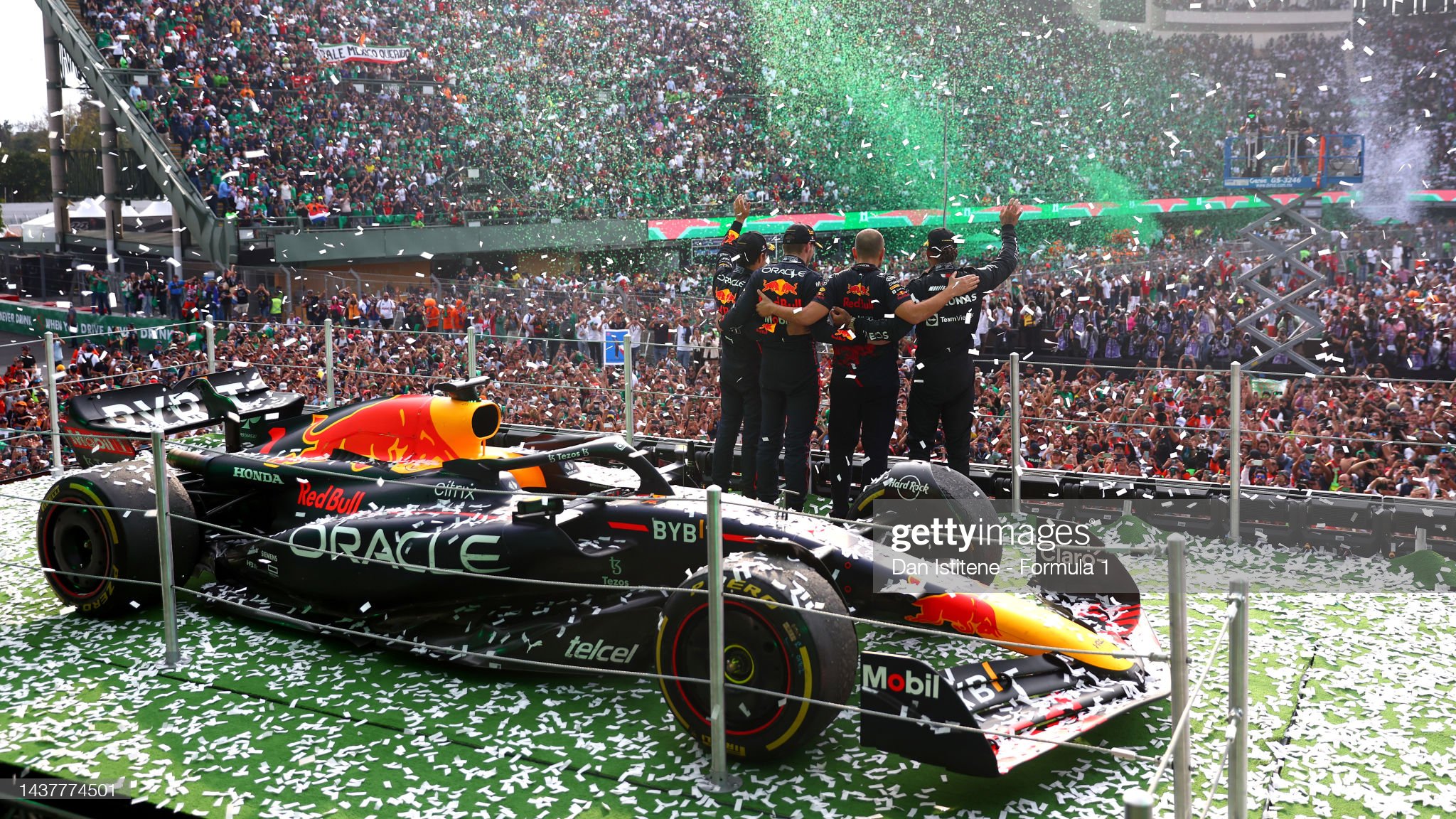 Race winner Max Verstappen, second placed Lewis Hamilton, third placed Sergio Perez and Red Bull Racing race engineer Gianpiero Lambiase celebrate on the podium.