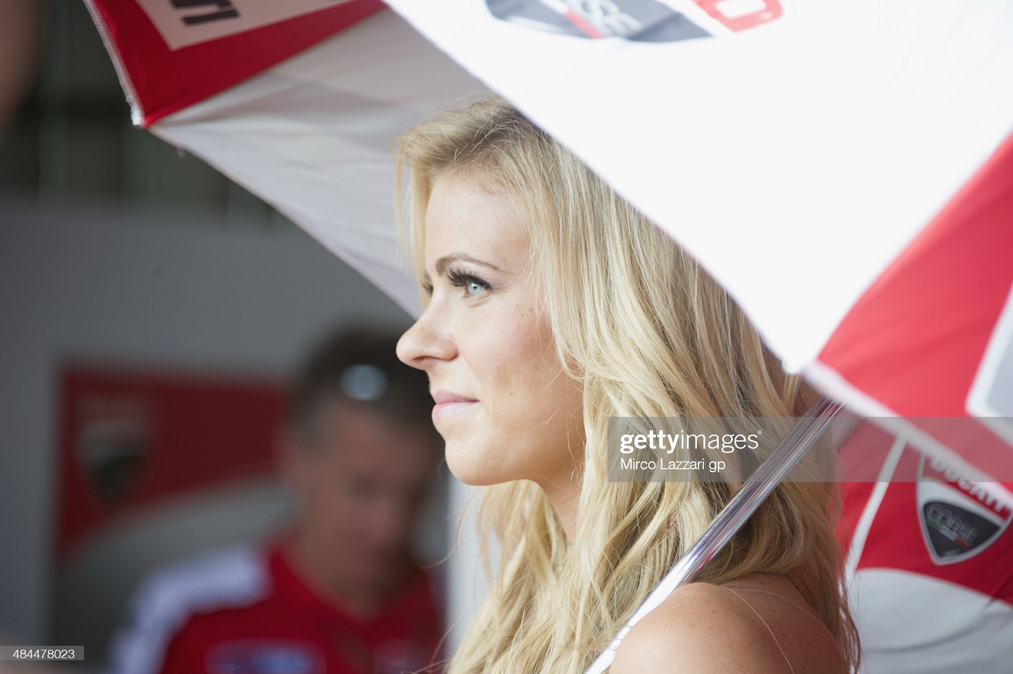 A grid girl smiles in the pits during the free practice of the MotoGp U.S. Grand Prix of the Americas on April 12, 2014 in Austin.