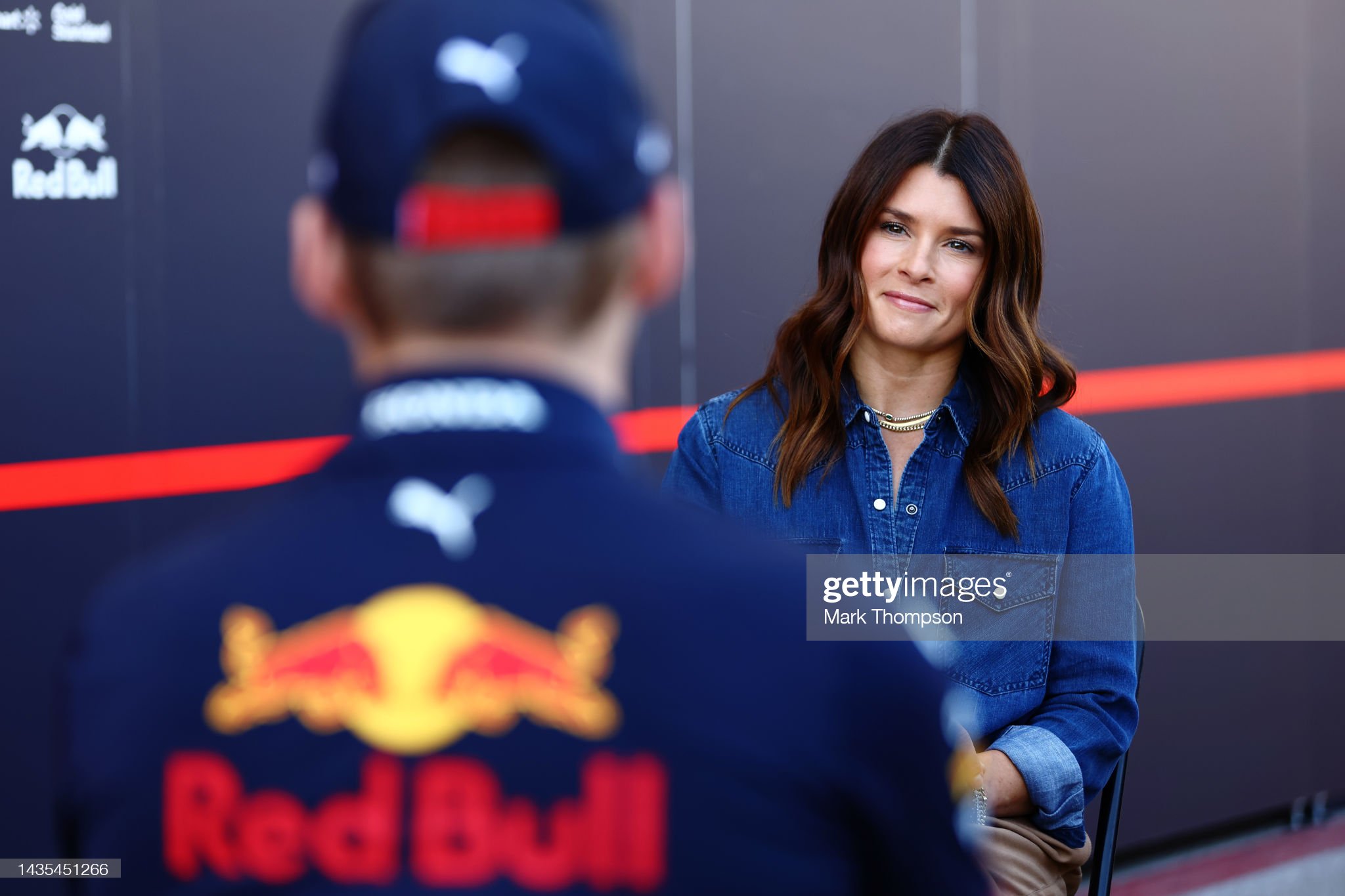 Danica Patrick talks with Max Verstappen.