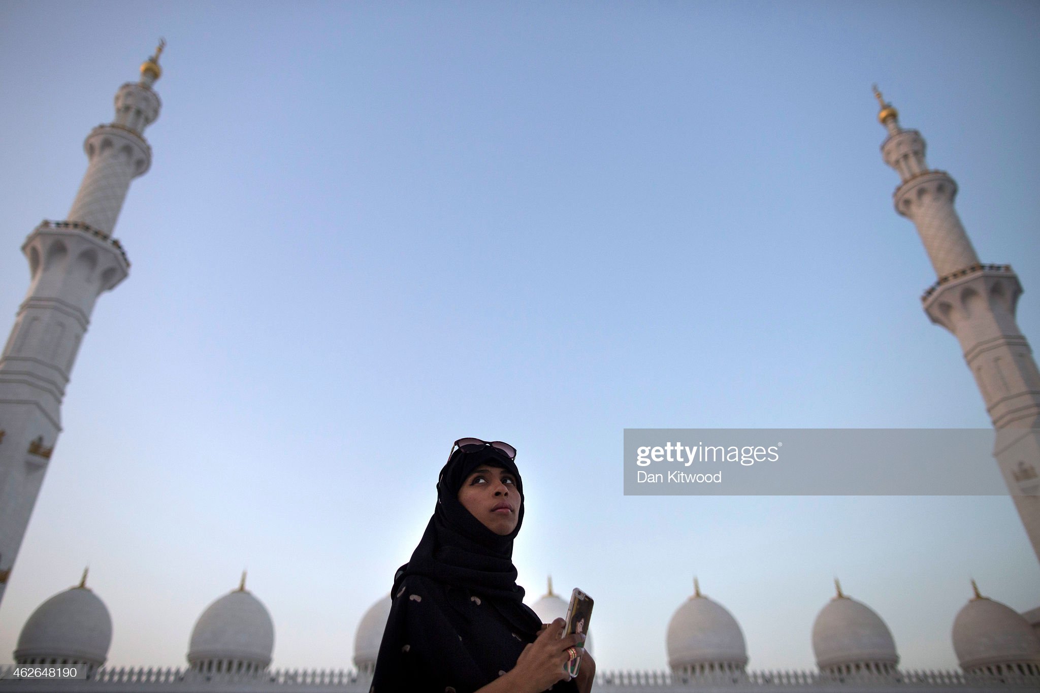 A woman stands inside the Sheikh Zayed Grand Mosque on February 01, 2015 in Abu Dhabi, United Arab Emirates. 