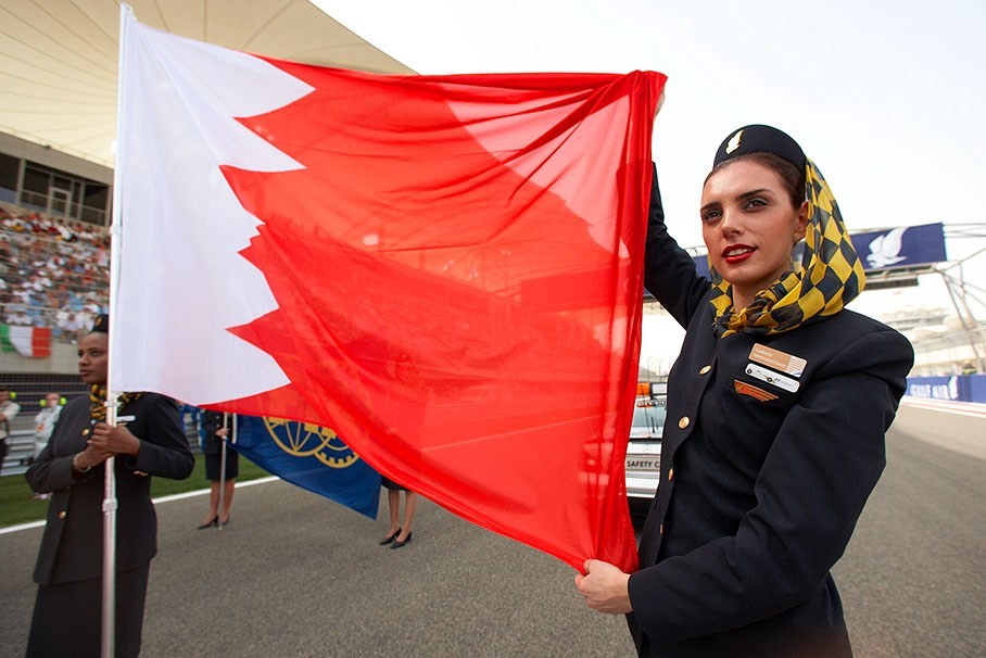 Bahrain 'grid stewardesses' hold the national flag at starting line, Sakhir, 2009. 