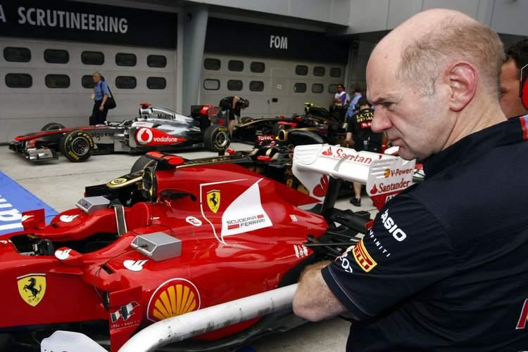 Adrian Newey watching a Ferrari.