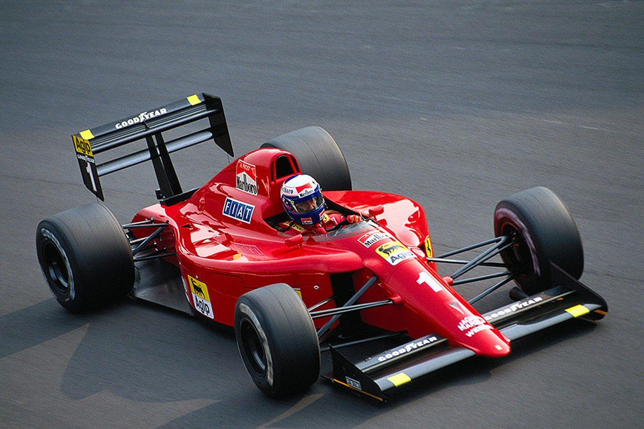 Alain Prost driving a Ferrari.