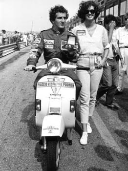 Alain Prost riding a Vespa and a girl.