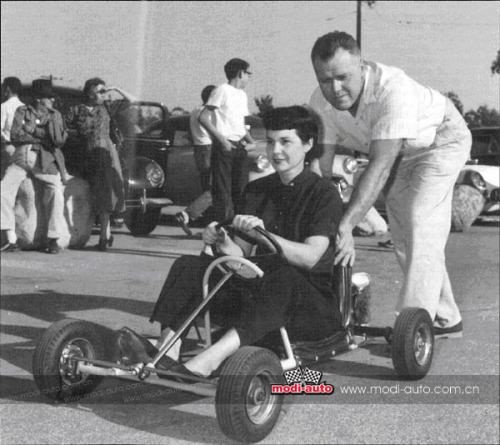 Art Ingels with a woman in a go-kart.