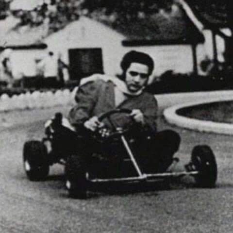Elvis Presley on a go-cart at Graceland.