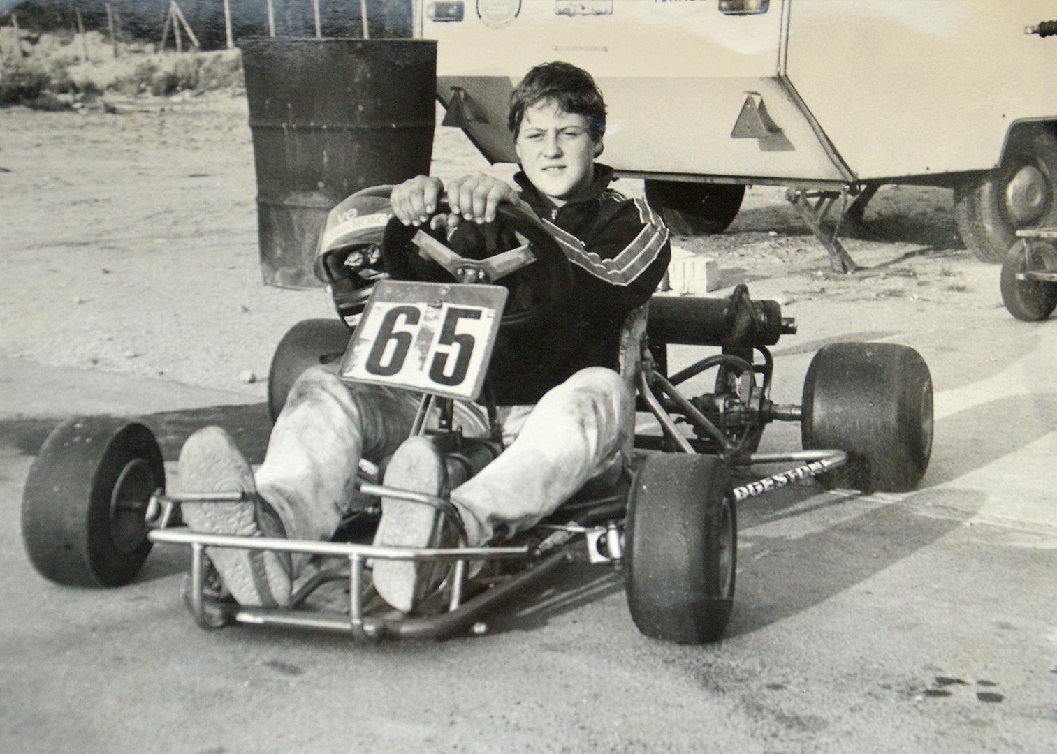 A young Michael Schumacher in a car.