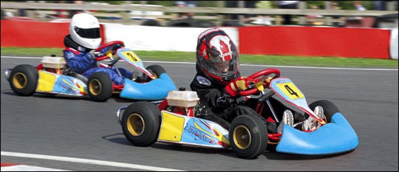 Two kid karts in action.