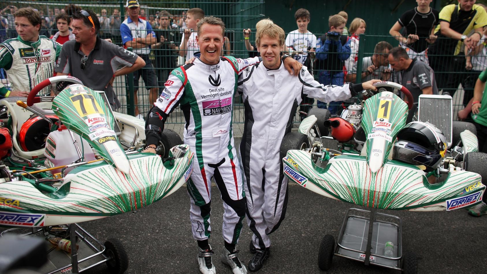 Michael Schumacher and Sebastian Vettel with their karts.