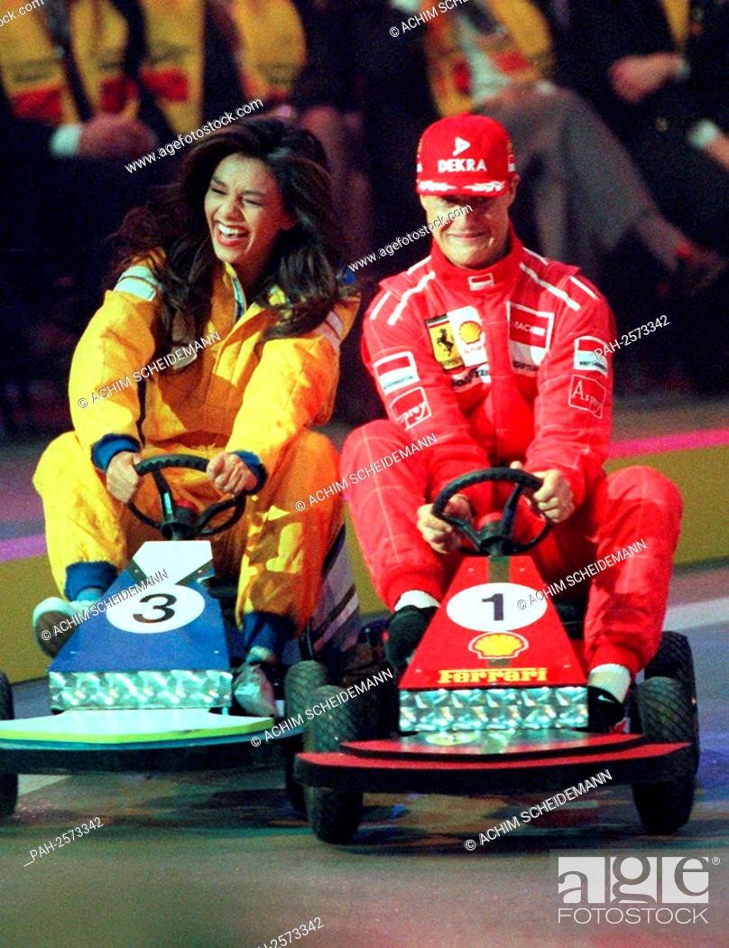 Verona Feldbusch, TV presenter, joins in a celebrity go-kart race with Michael Schumacher, pictured on 7th December 1996. 