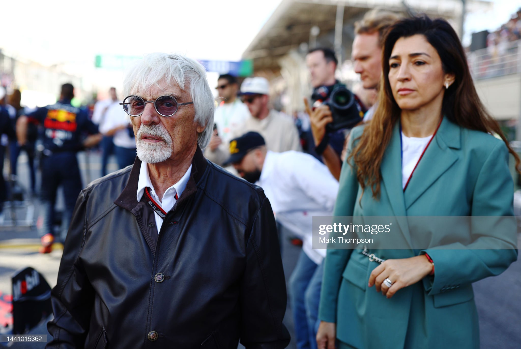 Bernie Ecclestone and Fabiana Ecclestone walk on the grid during the Sprint ahead of the F1 Grand Prix.