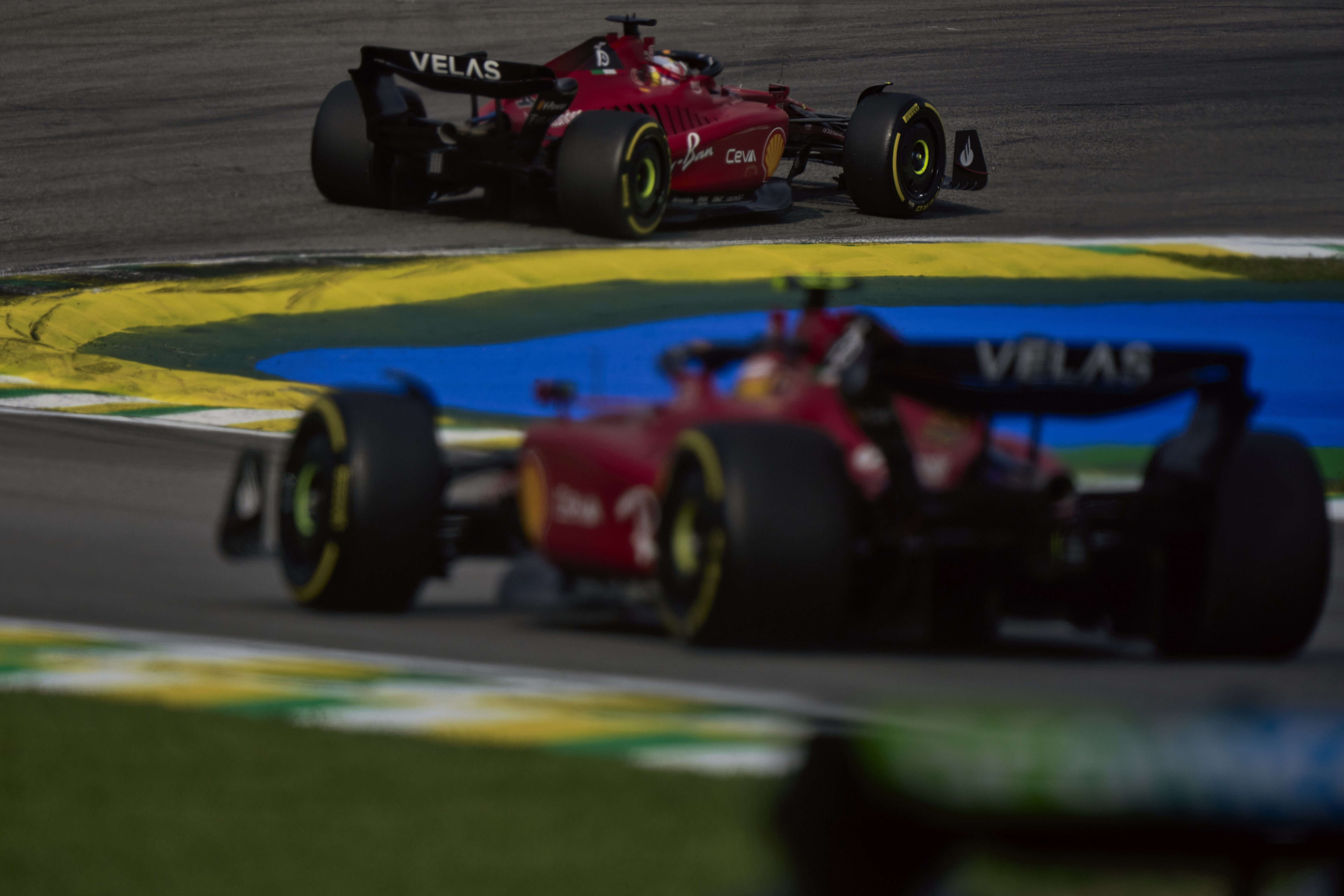 The 2 Ferraris racing.