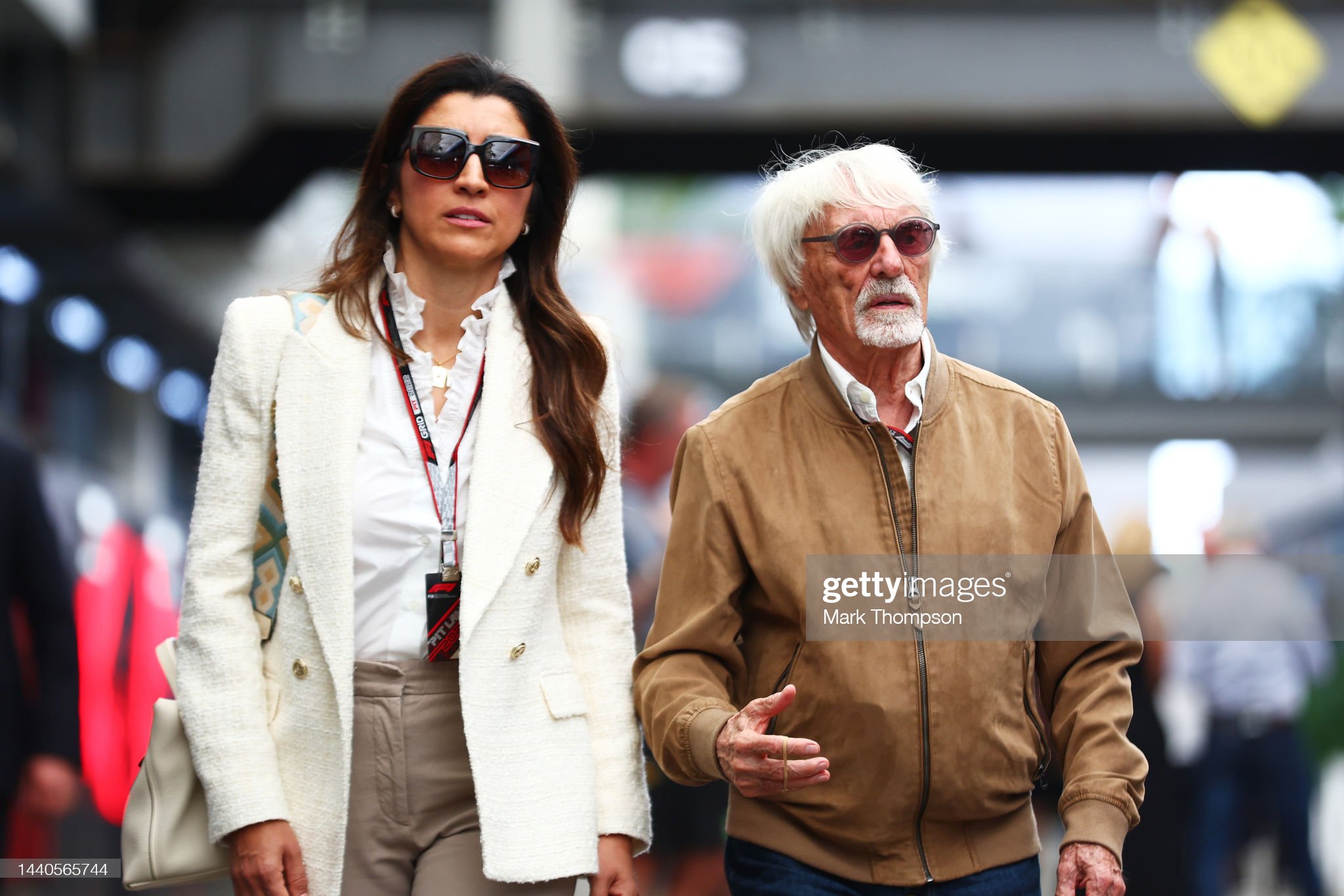 Bernie Ecclestone and Fabiana Ecclestone walk in the paddock during previews ahead of the F1 Grand Prix of Brazil at Autodromo Jose Carlos Pace on November 10, 2022 in Sao Paulo, Brazil. 