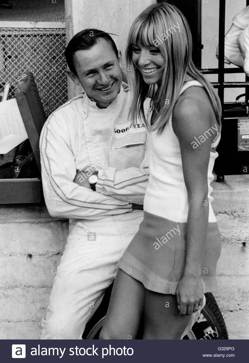 Bruce McLaren and admirer, 1967 Italian GP.