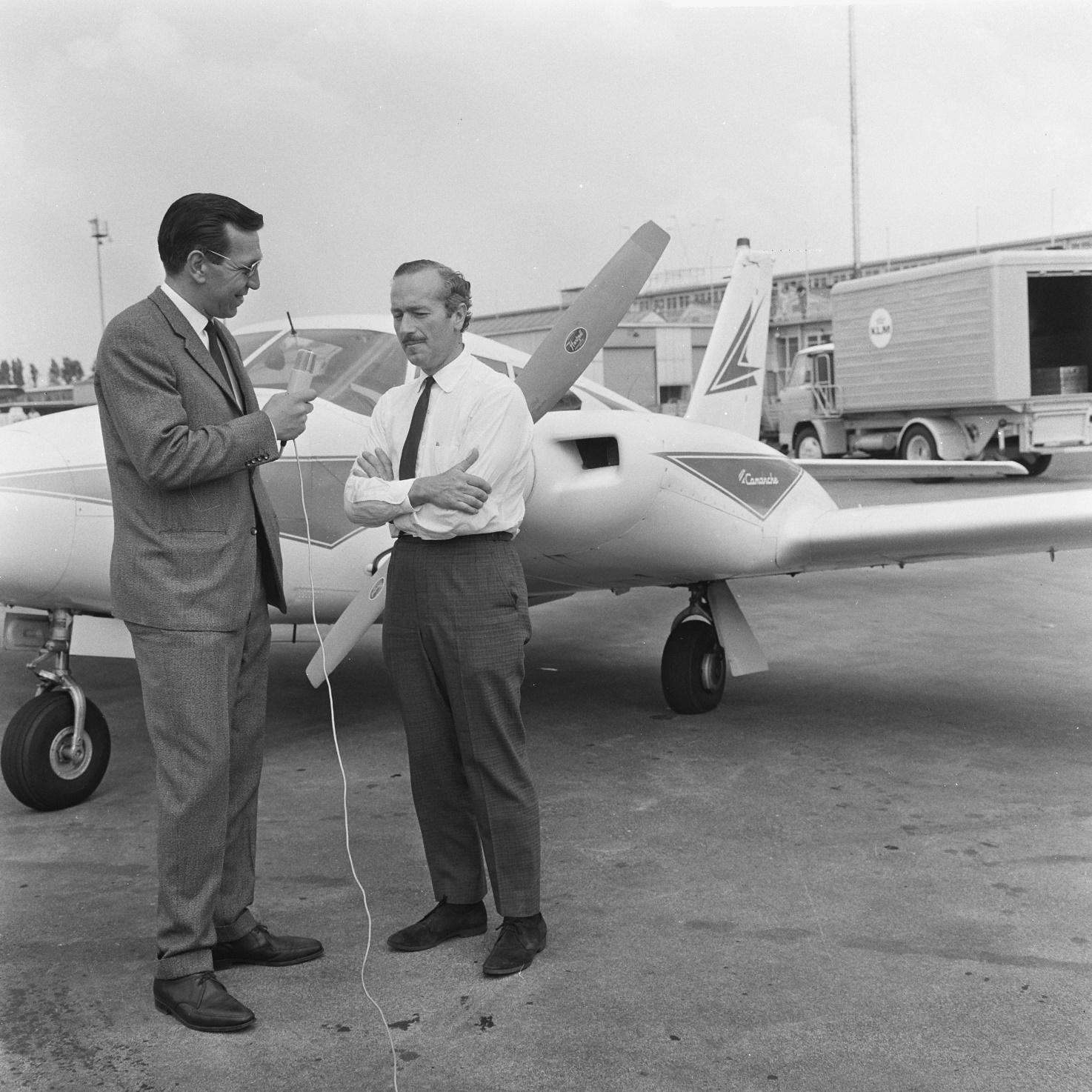 Colin Chapman interviewed in front of a private plane.
