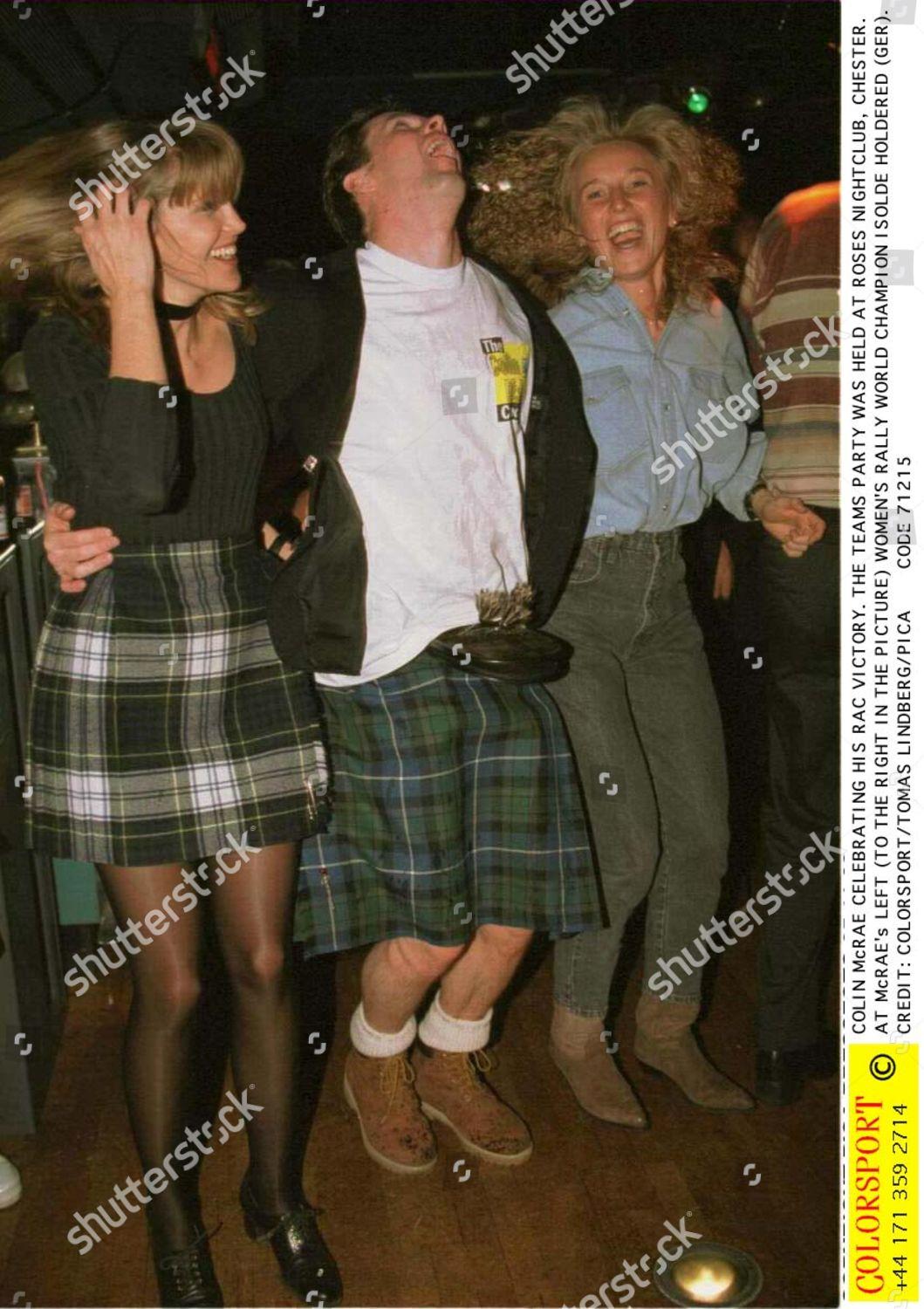 Colin McRae dancing with two female friends.