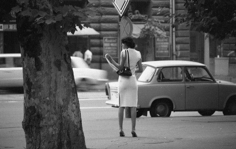 A woman in front of a Trabant.