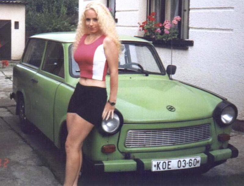 A young, blonde girl and a green Trabant.