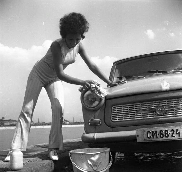 A girl washing a Trabant.