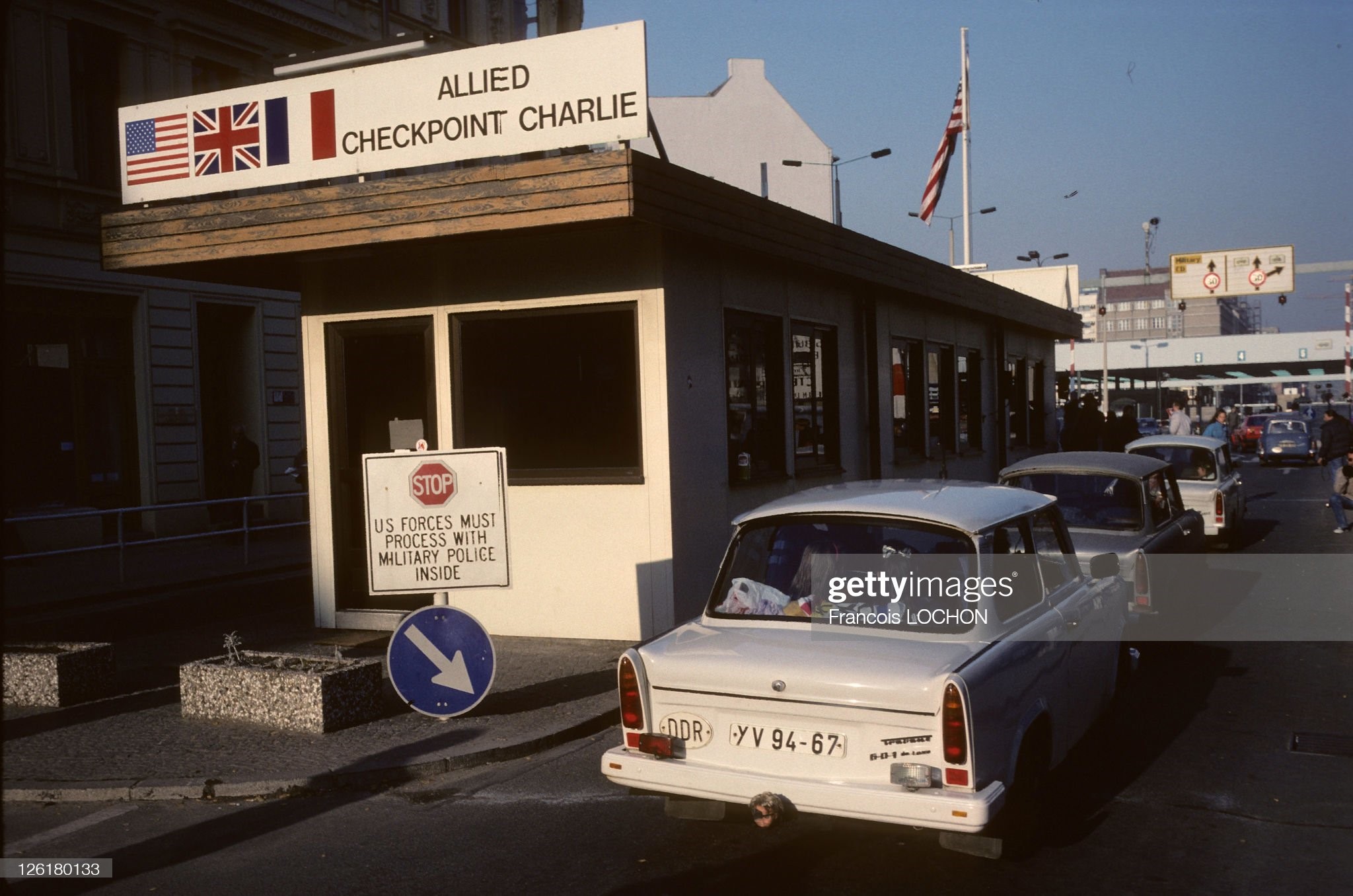 Checkpoint Charlie and Berlin Wall during 1989 in Berlin, Germany.