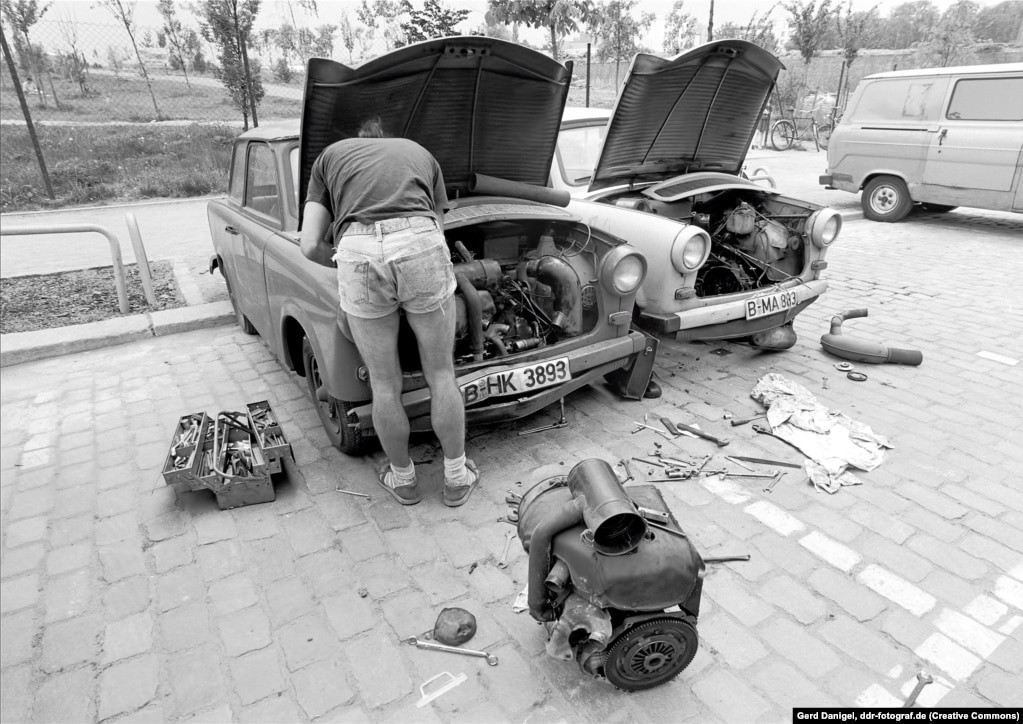 A man working on a Trabant.