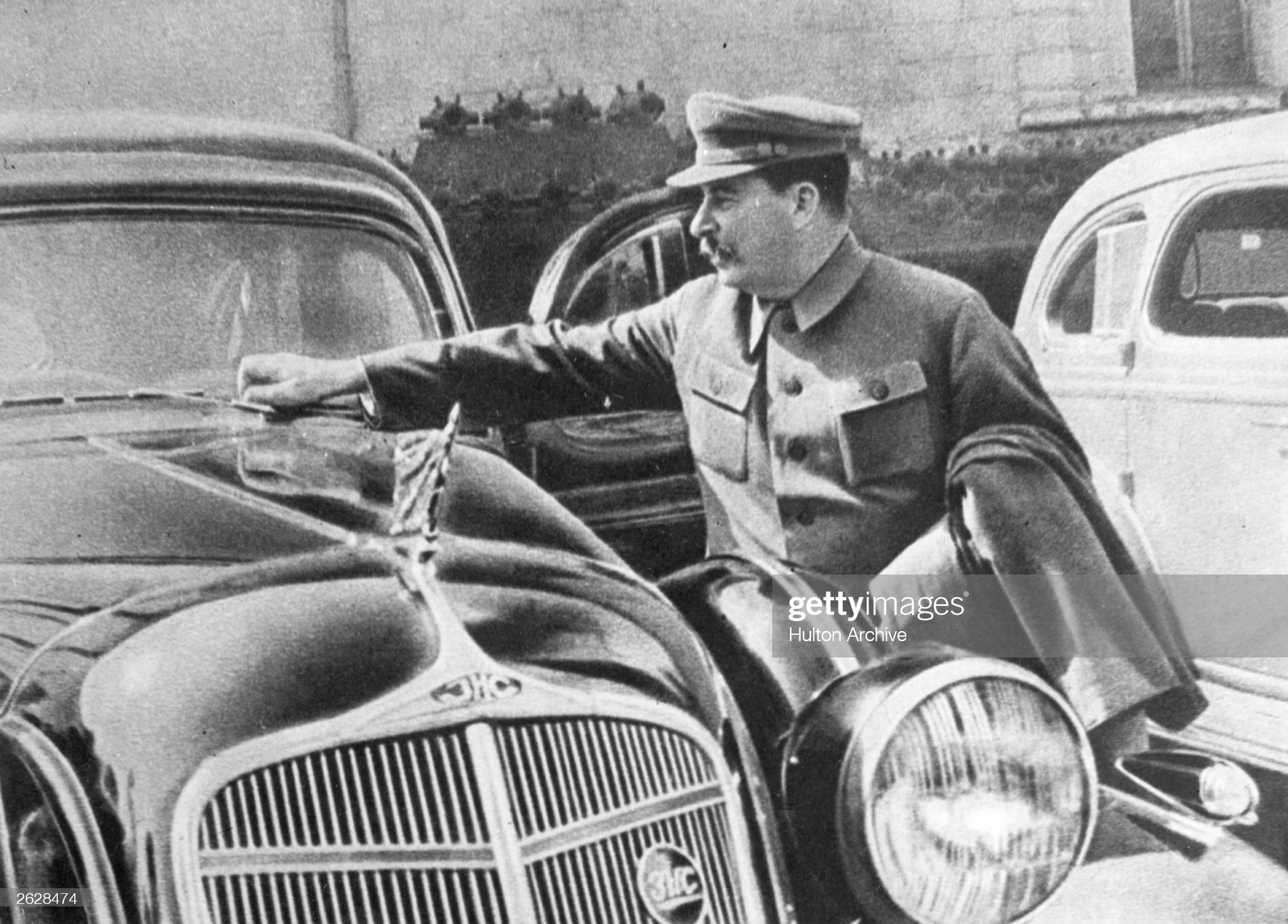 Soviet Communist leader Joseph Stalin adjusting the windscreen wipers on his car.