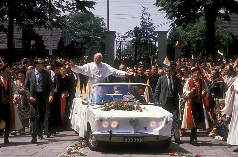 Pope John Paul II in a Polski Fiat 125p in front of the Częstochowa cathedral during his first pilgrimage to Poland in 1979.