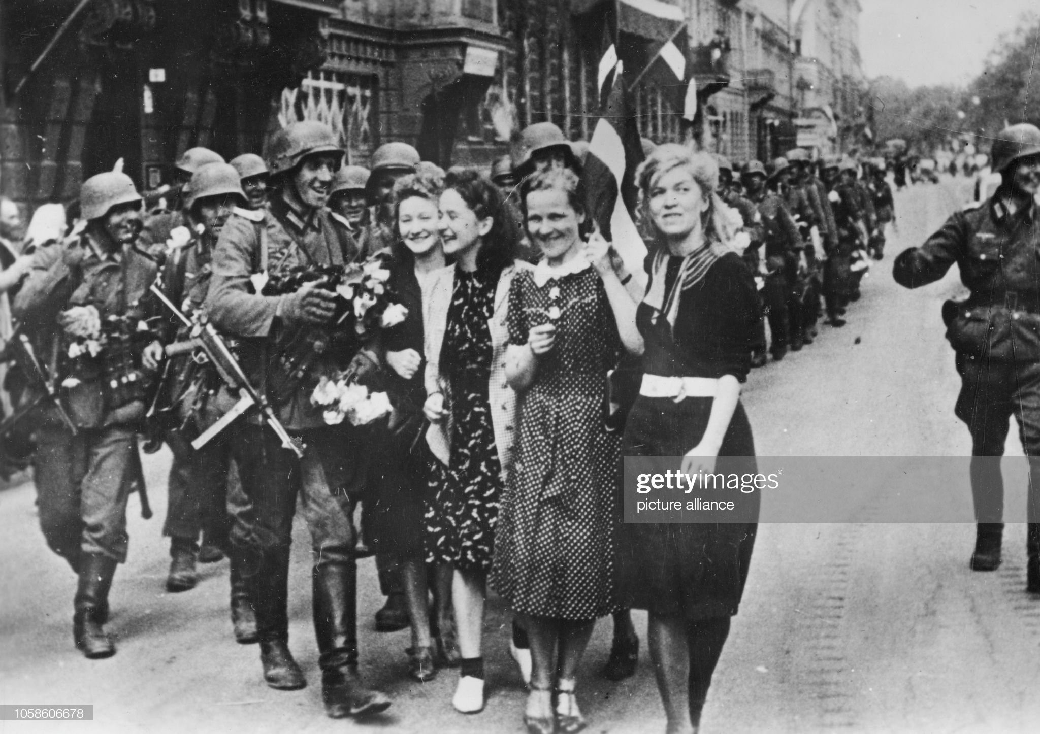 German soldiers are greeted by residents as they march into Soviet occupied Riga, Latvia, July 1941. 