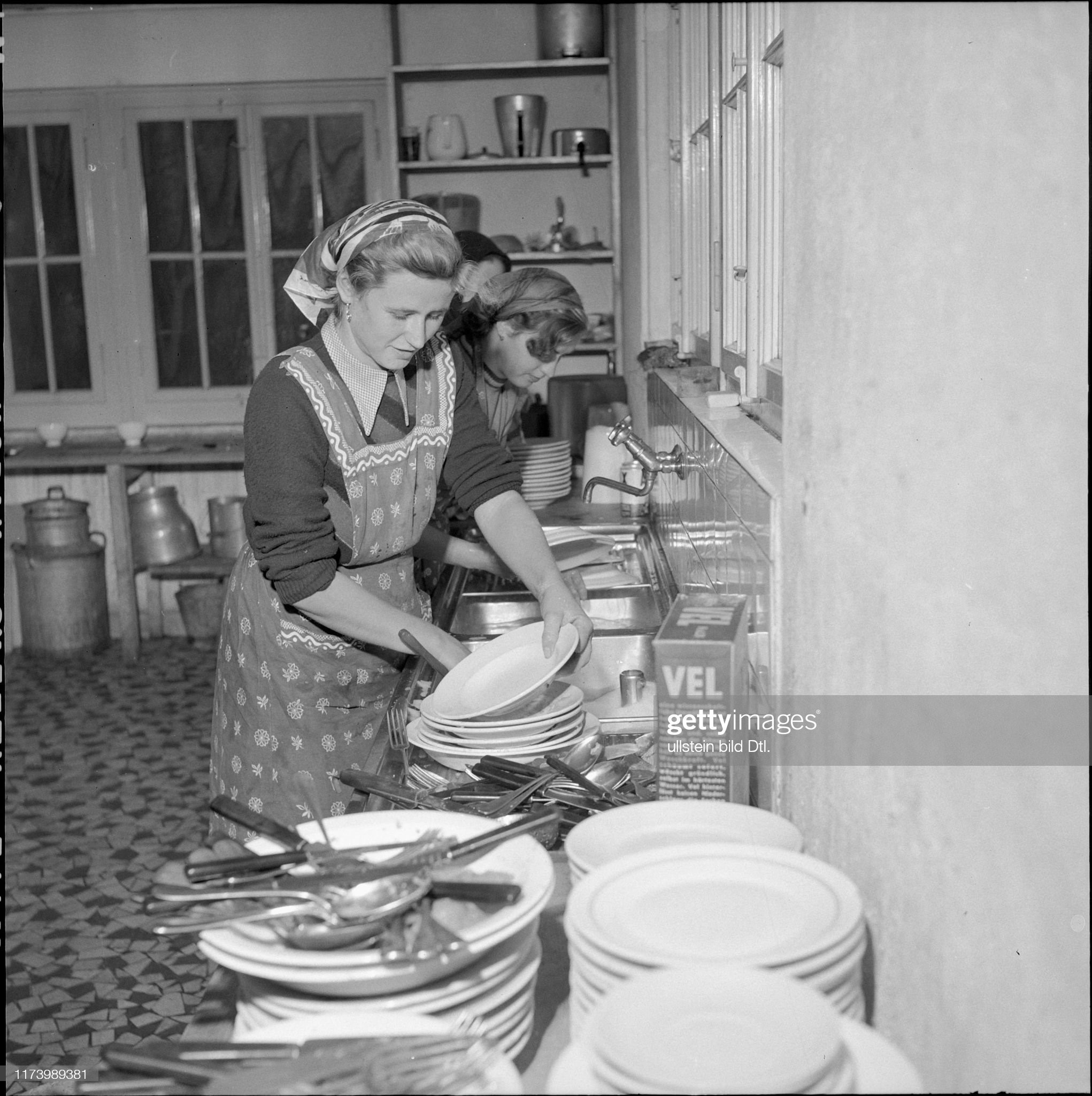 Hungarian woman washing dishes, 1956. 
