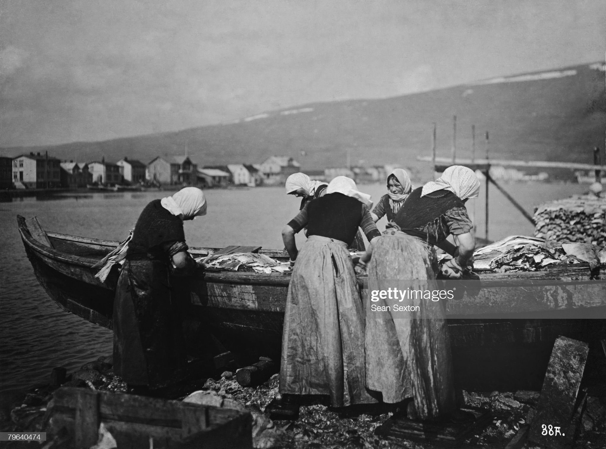 A group of women clean fish in Reykjavik, in preparation for export, 12th July 1914.