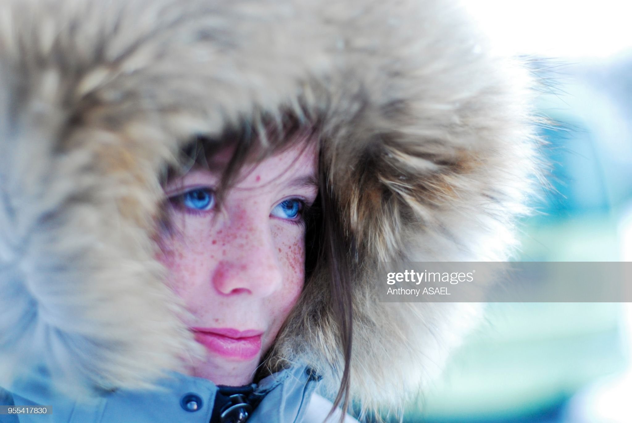 Iceland, Reykjavik, portrait of young girl in the cold with warm coat and hat.