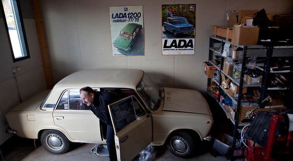 Risto Nykanen with one of the Ladas he has collected in Finland. Production of the car ends next month.