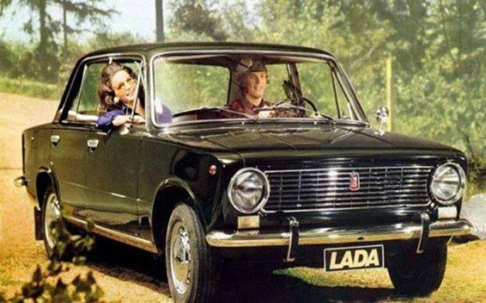 Two Russians drive their Lada.