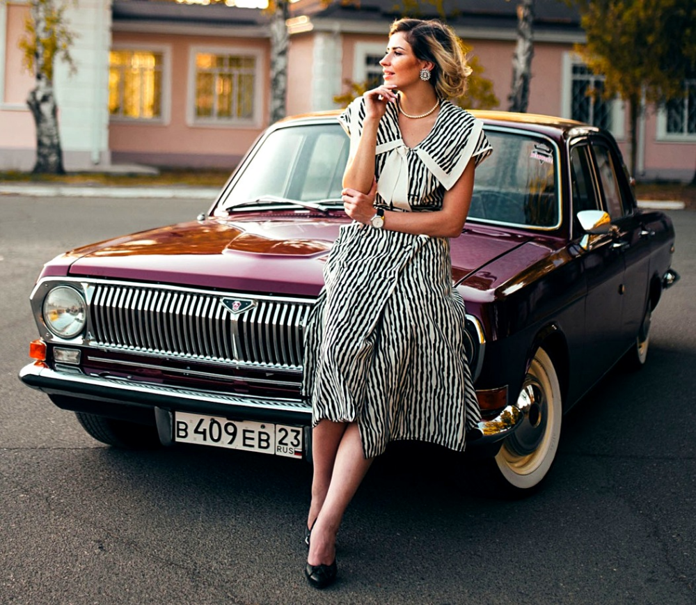 A girl and a Volga Gaz–24.