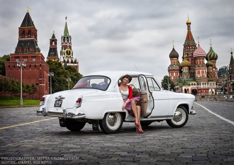 In retro style photo shoot with a Russian beauty and a Soviet car.