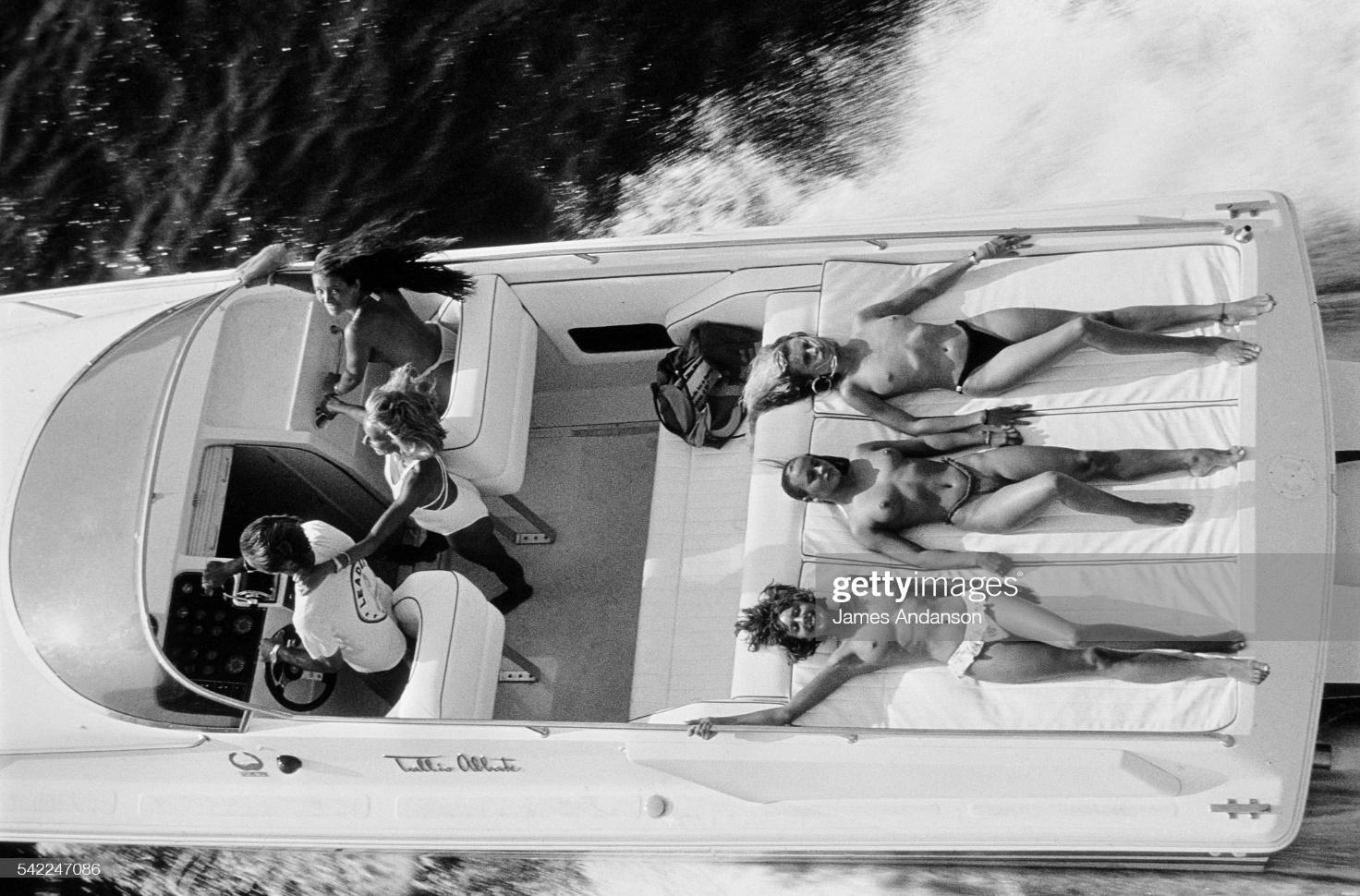 French socialite Jacqueline Veyssière, queen of the nights of Saint-Tropez, with friends aboard a Cigarette, a boat manufactured by Leader Racing, founded by former racing driver Didier Pironi.