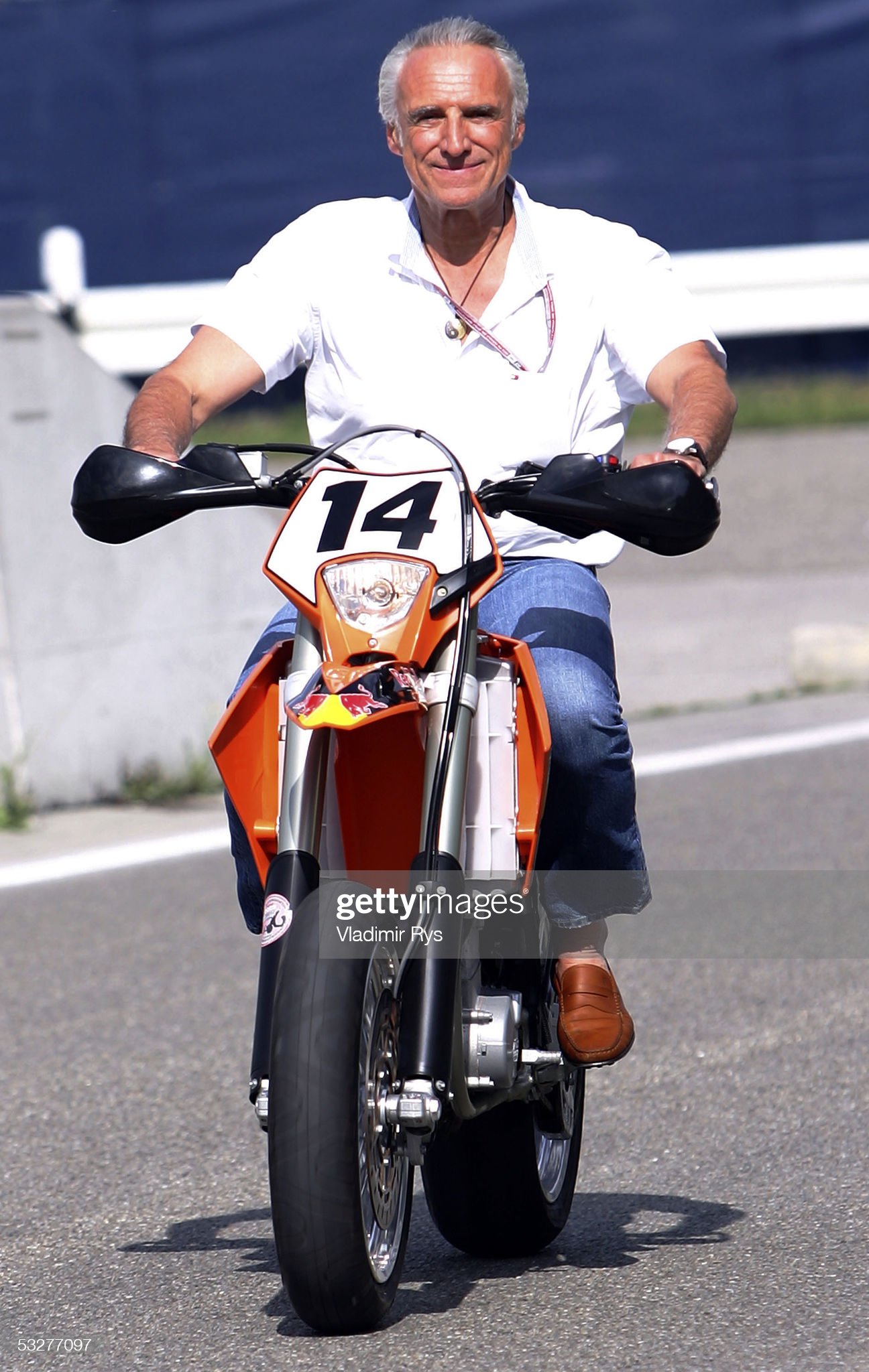 Dietrich Mateschitz drives a motorbike.