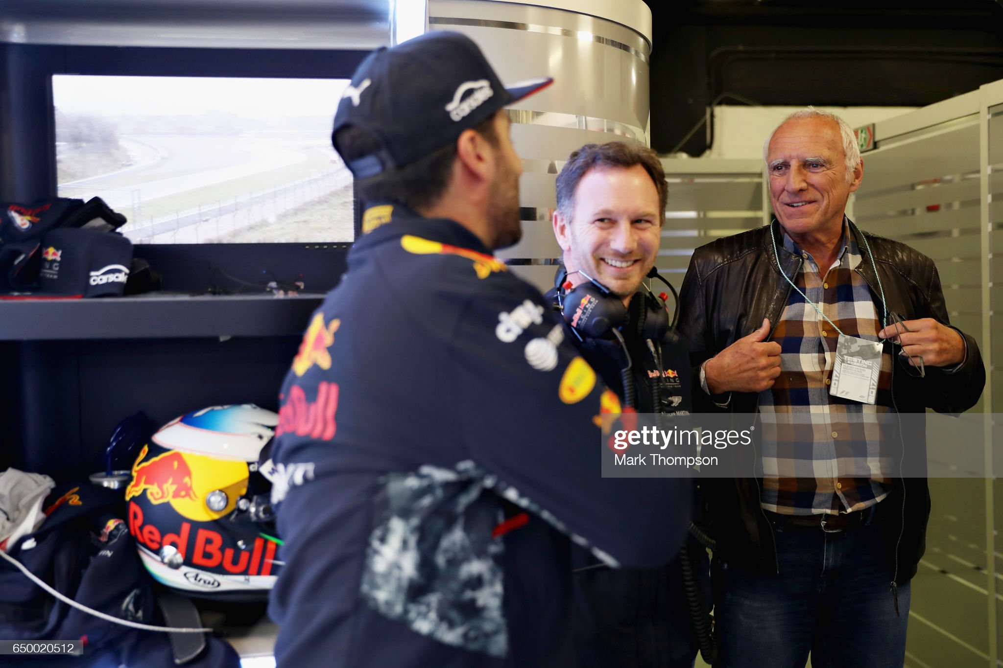Dietrich Mateschitz, Christian Horner and Daniel Ricciardo talk in the garage.