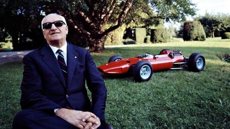 Enzo Ferrari and one of his cars.
