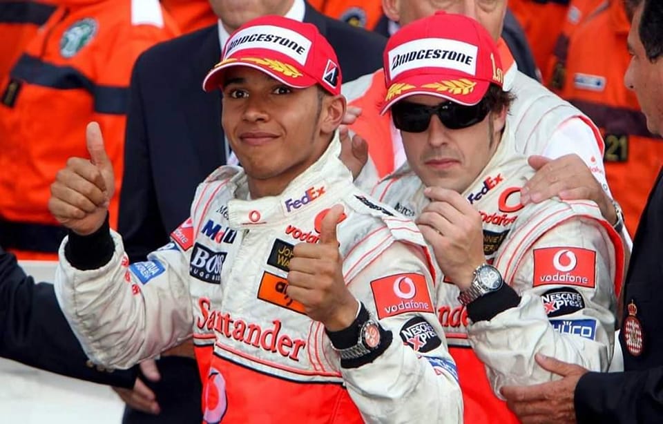 Fernando Alonso with Lewis Hamilton.