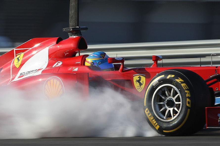 Fernando Alonso driving a Ferrari.