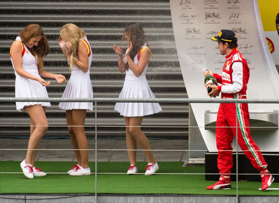 Fernando Alonso sprays some grid girls on the podium, Belgian Grand Prix, Spa-Francorchamps, August 25, 2013.