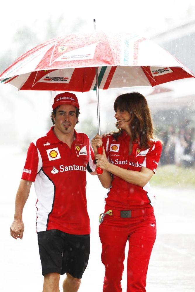 Fernando Alonso with a woman working for Ferrari.