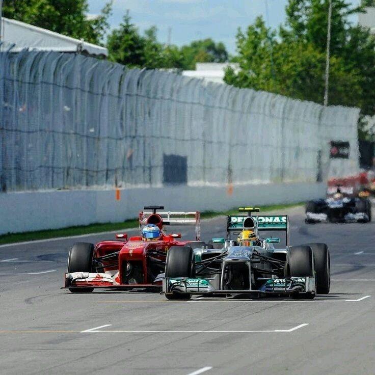 Fernando Alonso, Ferrari, fighting with Lewis Hamilton, Mercedes.