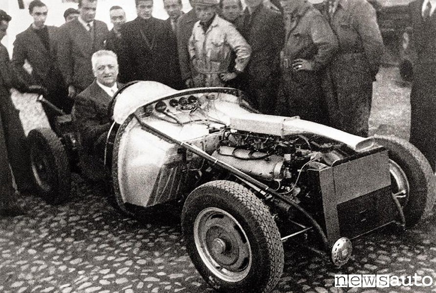 Enzo Ferrari in one of his cars.